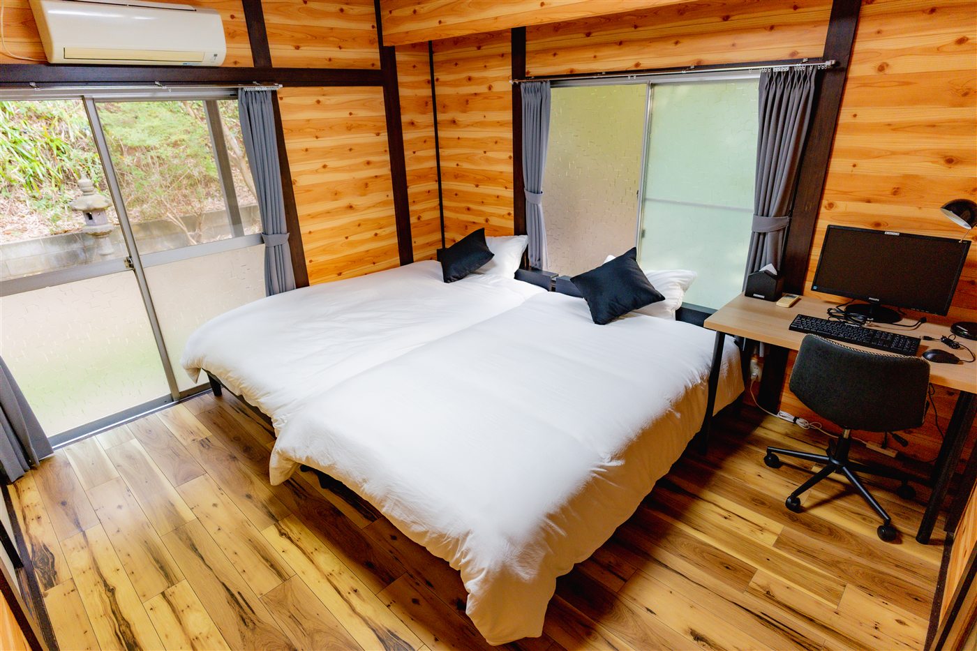 Wood-walled bedroom